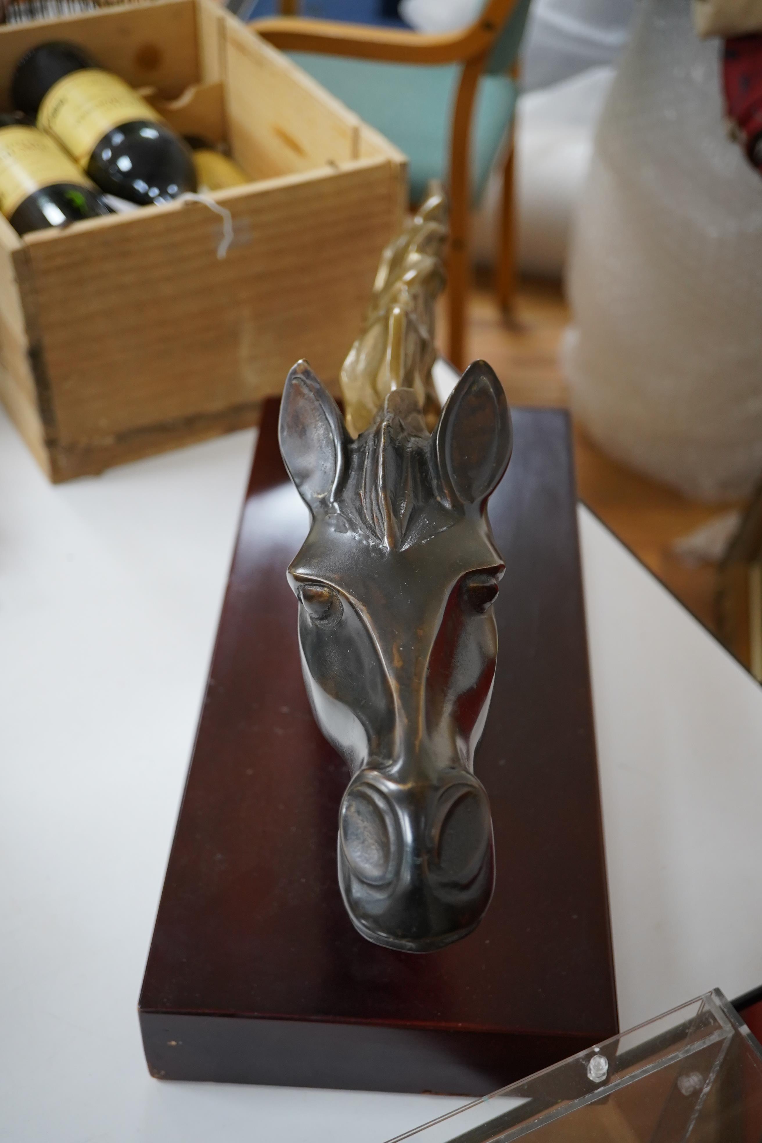 A French Art Deco patinated brass model of a horses head, unsigned, 60cm wide. Condition - fair to good